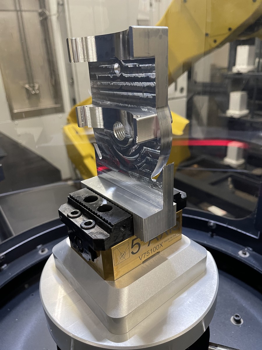 Close-up of a workpiece being machined in a CNC mill