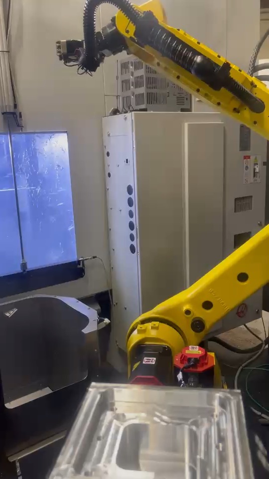 FANUC robot arm in automated CNC machining cell