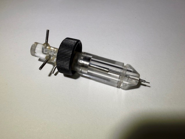 Precision medical device assembly with machined and molded components